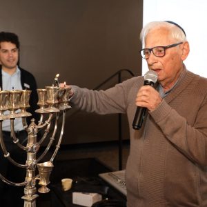 Holocaust survivor at hanukkah candle lighting